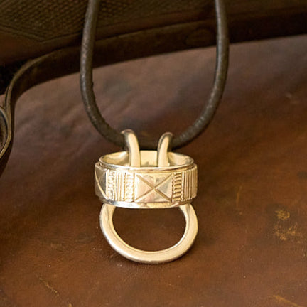 Silver Ring on a ring saver necklace with a leather cord
